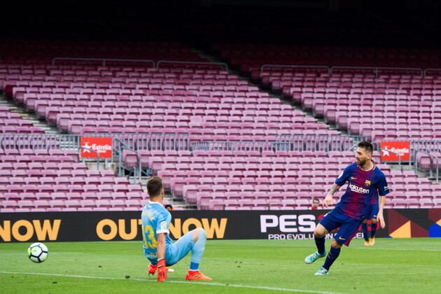 BARCELONA, SPAIN - OCTOBER 01: Lionel Messi of FC Barcelona scores his team's third goal during the La Liga match between Barcelona and Las Palmas at Camp Nou on October 1, 2017 in Barcelona, Spain. The match is being played with empty stands after the events occured in Catalonia during the voting of a Catalonia independence referendum declared illegal and undemocratic by the Spanish government. (Photo by Alex Caparros/Getty Images) BARCELONA, SPAIN - OCTOBER 01: Lionel Messi of FC Barcelona scores his team's third goal during the La Liga match between Barcelona and Las Palmas at Camp Nou on October 1, 2017 in Barcelona, Spain. The match is being played with empty stands after the events occured in Catalonia during the voting of a Catalonia independence referendum declared illegal and undemocratic by the Spanish government. (Photo by Alex Caparros/Getty Images)