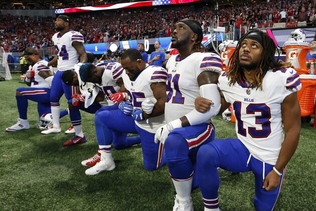 Buffalo Bills players take a knee during the national anthem before the first half of an NFL football game between the Atlanta Falcons and the Buffalo Bills, Sunday, Oct. 1, 2017, in Atlanta. (AP Photo/John Bazemore)