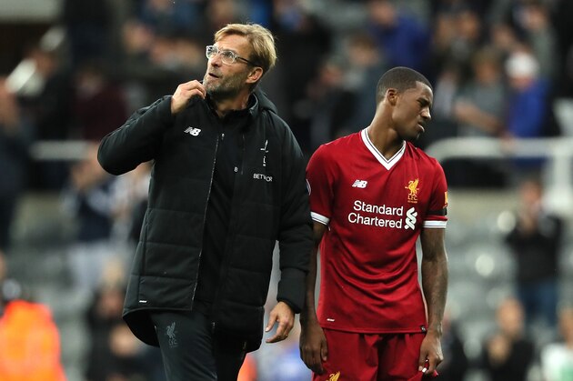 NEWCASTLE UPON TYNE, ENGLAND - OCTOBER 01:  Liverpool Head Coach / Manager Jurgen Klopp and Georginio Wijnaldum of Liverpool react at the end of the Premier League match between Newcastle United and Liverpool at St. James' Park on October 1, 2017 in Newcastle upon Tyne, England.  (Photo by Matthew Ashton - AMA/Getty Images)