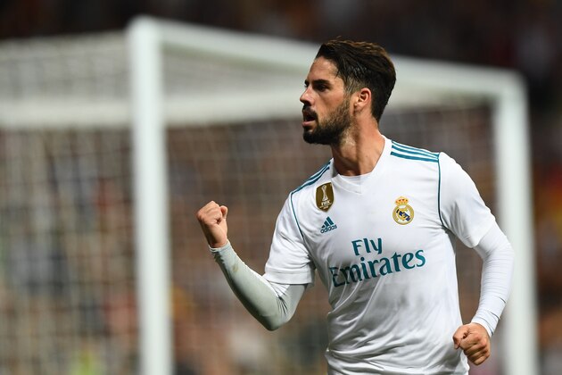 Real Madrid's midfielder Isco celebrates his second goal during the Spanish league football match Real Madrid CF vs RCD Espanyol at the Santiago Bernabeu stadium in Madrid on October 1, 2017. / AFP PHOTO / GABRIEL BOUYS        (Photo credit should read GABRIEL BOUYS/AFP/Getty Images)