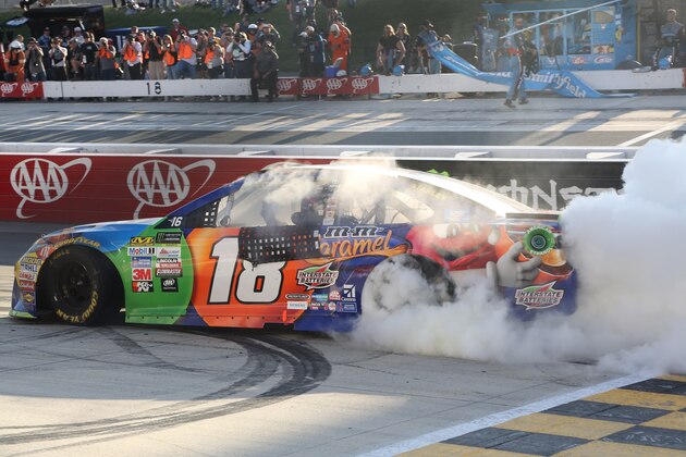 DOVER, DE - OCTOBER 01:  Kyle Busch, driver of the #18 M&M's Caramel Toyota, celebrates with a burnout after winning the Monster Energy NASCAR Cup Series Apache Warrior 400 presented by Lucas Oil at Dover International Speedway on October 1, 2017 in Dover, Delaware.  (Photo by Jerry Markland/Getty Images)