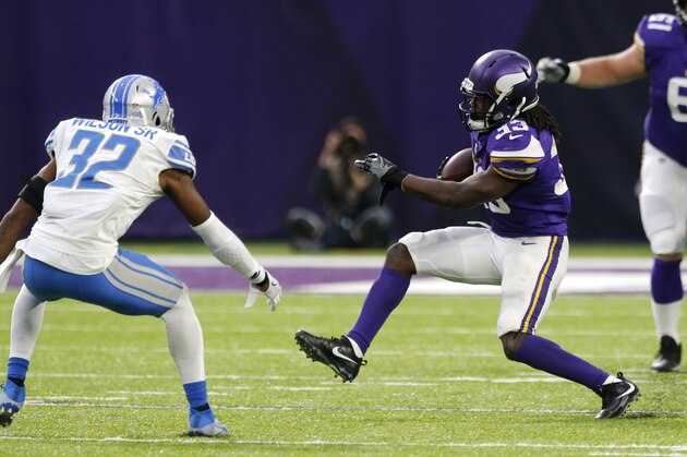 Minnesota Vikings running back Dalvin Cook (33) runs from Detroit Lions strong safety Tavon Wilson (32) during the second half of an NFL football game, Sunday, Oct. 1, 2017, in Minneapolis. Cook was injured on the play. (AP Photo/Jim Mone)
