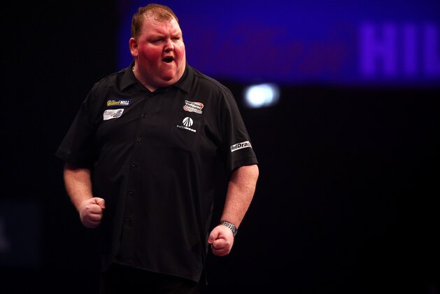 LONDON, ENGLAND - DECEMBER 23: John Henderson of Scotland celebrates winning a leg during his first round match against Vincent van der Voort of Holland during the William Hill PDC World Darts Championships on Day Six at Alexandra Palace on December 23, 2014 in London, England. (Photo by Charlie Crowhurst/Getty Images)