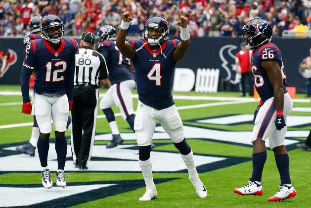 HOUSTON, TX - OCTOBER 01:  Deshaun Watson #4 of the Houston Texans celebrates with Bruce Ellington #12 and Lamar Miller #26 after scoring on a one yard run in the second quarter against the Tennessee Titans at NRG Stadium on October 1, 2017 in Houston, Texas.  (Photo by Bob Levey/Getty Images)
