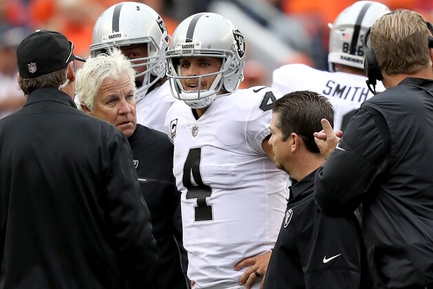 DENVER, CO - OCTOBER 01:  Quarterback Derek Carr #4 of the Oakland Raiders leaves the game with an injury against the Denver Broncos at Sports Authority Field at Mile High on October 1, 2017 in Denver, Colorado.  (Photo by Matthew Stockman/Getty Images)