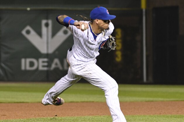 CHICAGO, IL - SEPTEMBER 13: Javier Baez #9 of the Chicago Cubs makes a play against the New York Mets on September 13, 2017 at Wrigley Field  in Chicago, Illinois. (Photo by David Banks/Getty Images)