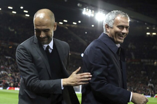 FILE - In this Wednesday, Oct. 26, 2016 file photo, Manchester City's manager Pep Guardiola, left, and Manchester United's manager Jose Mourinho smile ahead of their English League Cup soccer match at Old Trafford stadium in Manchester. There were handshakes, smiles, even an embrace, in the first two head-to-heads between Pep Guardiola and Jose Mourinho in English soccer. With the pressure and tension ramped up a notch for the third Manchester derby of the season, will the two coaching adversaries be able to retain their new-found cordiality on Thursday, April 27? (AP Photo/Dave Thompson, file)