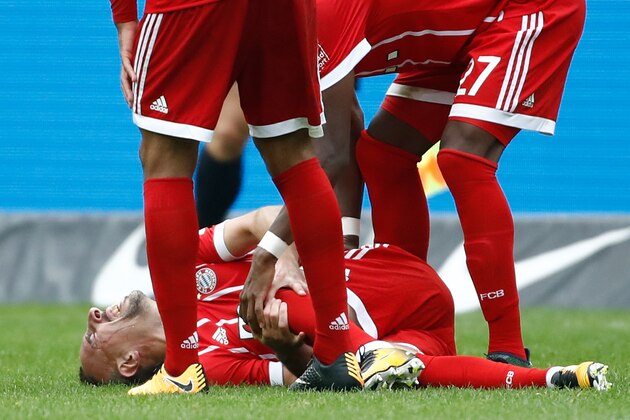 Bayern Munich's Austrian defender David Alaba (R) and Bayern Munich's French midfielder Corentin Tolisso check on their tgeammate French midfielder Franck Ribery after he injured his knee during the German first division Bundesliga football match between Hertha Berlin and FC Bayern Munich in Berlin, on October 1, 2017. / AFP PHOTO / Odd ANDERSEN / RESTRICTIONS: DURING MATCH TIME: DFL RULES TO LIMIT THE ONLINE USAGE TO 15 PICTURES PER MATCH AND FORBID IMAGE SEQUENCES TO SIMULATE VIDEO. == RESTRICTED TO EDITORIAL USE == FOR FURTHER QUERIES PLEASE CONTACT DFL DIRECTLY AT + 49 69 650050
        (Photo credit should read ODD ANDERSEN/AFP/Getty Images)