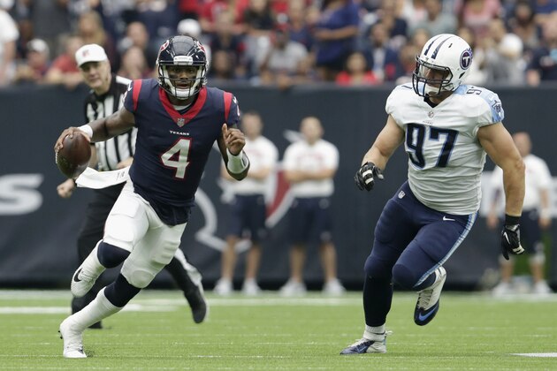 HOUSTON, TX - OCTOBER 01:  Deshaun Watson #4 of the Houston Texans scrambles pursued by Karl Klug #97 of the Tennessee Titans in the third quarter at NRG Stadium on October 1, 2017 in Houston, Texas.  (Photo by Tim Warner/Getty Images)