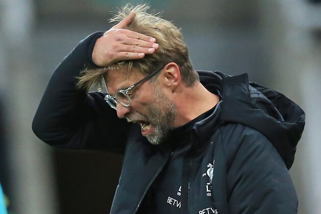 Liverpool's German manager Jurgen Klopp gestures on the touchline during the English Premier League football match between Newcastle United and Liverpool at St James' Park in Newcastle-upon-Tyne, north east England on October 1, 2017.
The game ended 1-1. / AFP PHOTO / Lindsey PARNABY / RESTRICTED TO EDITORIAL USE. No use with unauthorized audio, video, data, fixture lists, club/league logos or 'live' services. Online in-match use limited to 75 images, no video emulation. No use in betting, games or single club/league/player publications.  /         (Photo credit should read LINDSEY PARNABY/AFP/Getty Images)