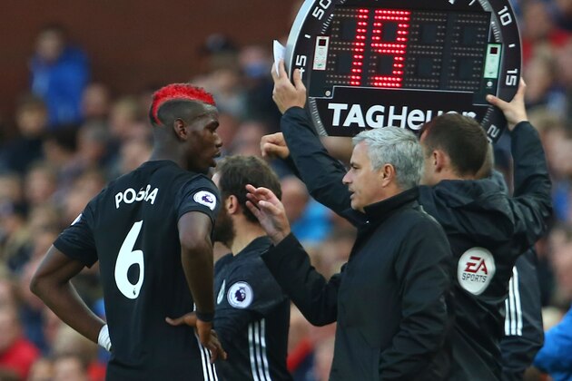 Manchester United's Portuguese manager Jose Mourinho (2R) gives instructions to Manchester United's French midfielder Paul Pogba (L) during the English Premier League football match between Stoke City and Manchester United at the Bet365 Stadium in Stoke-on-Trent, central England on September 9, 2017. / AFP PHOTO / Geoff CADDICK / RESTRICTED TO EDITORIAL USE. No use with unauthorized audio, video, data, fixture lists, club/league logos or 'live' services. Online in-match use limited to 75 images, no video emulation. No use in betting, games or single club/league/player publications.  /         (Photo credit should read GEOFF CADDICK/AFP/Getty Images)