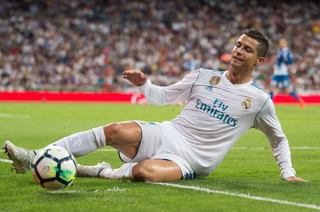 MADRID, SPAIN - OCTOBER 01: Cristiano Ronaldo of Real Madrid CF tries to keep the ball in play during the La Liga match between Real Madrid and Espanyol at Estadio Santiago Bernabeu on October 1, 2017 in Madrid, Spain. (Photo by Denis Doyle/Getty Images)