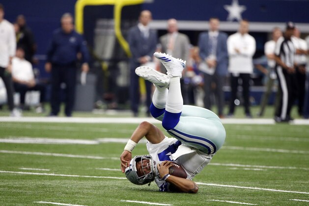 Dallas Cowboys quarterback Dak Prescott (4) is knocked to the ground scrambling out of the pocket in the second half of an NFL football game against the Los Angeles Rams on Sunday, Oct. 1, 2017, in Arlington, Texas. (AP Photo/Michael Ainsworth) Dallas Cowboys quarterback Dak Prescott (4) is knocked to the ground scrambling out of the pocket in the second half of an NFL football game against the Los Angeles Rams on Sunday, Oct. 1, 2017, in Arlington, Texas. (AP Photo/Michael Ainsworth)
