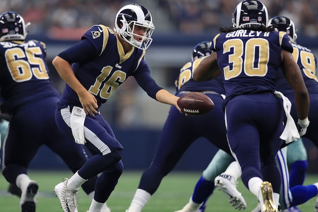 ARLINGTON, TX - OCTOBER 01:  Jared Goff #16 of the Los Angeles Rams hands the ball off to Todd Gurley #30 in the first half of a game against the Dallas Cowboys at AT&T Stadium on October 1, 2017 in Arlington, Texas.  (Photo by Ronald Martinez/Getty Images)