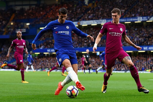 LONDON, ENGLAND - SEPTEMBER 30: Alvaro Morata of Chelsea is put under pressure from John Stones of Manchester City during the Premier League match between Chelsea and Manchester City at Stamford Bridge on September 30, 2017 in London, England.  (Photo by Clive Rose/Getty Images)