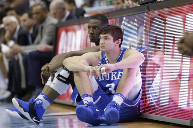 Duke's Grayson Allen (3) and Harry Giles wait to enter the game during the second half of an NCAA college basketball game against North Carolina in Chapel Hill, N.C., Saturday, March 4, 2017. North Carolina won 90-83. (AP Photo/Gerry Broome)