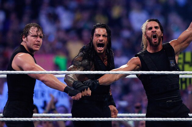 The Shield reacts after their win during Wrestlemania XXX at the Mercedes-Benz Super Dome in New Orleans on Sunday, April 6, 2014. (Jonathan Bachman/AP Images for WWE)