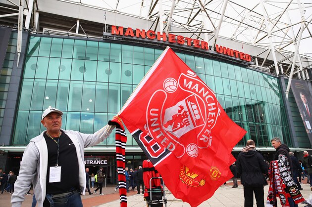 MANCHESTER, ENGLAND - SEPTEMBER 30: A Manchester United fan is seen outside the stadium prior to the Premier League match between Manchester United and Crystal Palace at Old Trafford on September 30, 2017 in Manchester, England.  (Photo by Clive Brunskill/Getty Images)