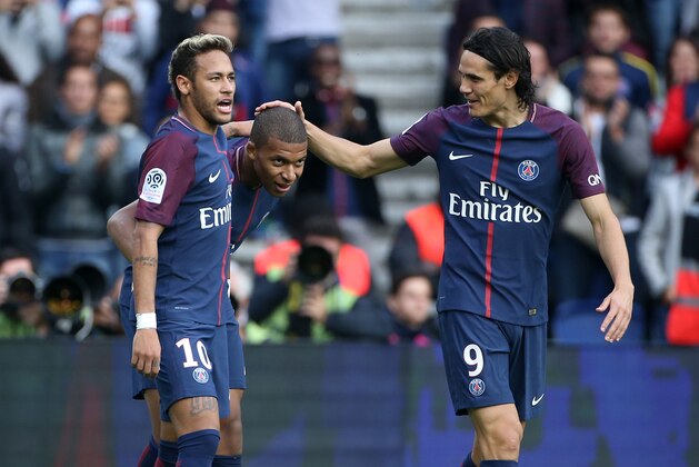 PARIS, FRANCE - SEPTEMBER 30: Kylian Mbappe of PSG celebrates his goal between Neymar Jr and Edinson Cavani during the French Ligue 1 match between Paris Saint-Germain (PSG) and FC Girondins de Bordeaux at Parc des Princes on September 30, 2017 in Paris, France. (Photo by Jean Catuffe/Getty Images)