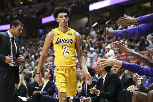 Los Angeles Lakers guard Lonzo Ball greets with teammates during the first half of an NBA preseason basketball game against Minnesota Timberwolves in Anaheim, Calif., Saturday, Sept. 30, 2017. (AP Photo/Ringo H.W. Chiu)
