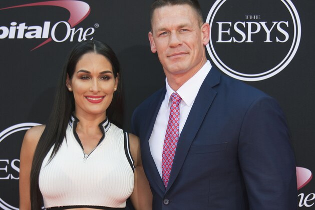 Wreslers Nikki Bella (L) and John Cena attend the 25th ESPYS at the Microsoft Theater on July 12, 2017 in Los Angeles, California. / AFP PHOTO / VALERIE MACON        (Photo credit should read VALERIE MACON/AFP/Getty Images)