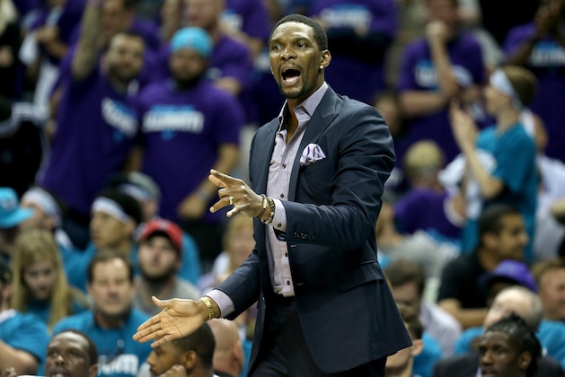 CHARLOTTE, NC - APRIL 25:  Chris Bosh #1 of the Miami Heat watches on from the bench against the Charlotte Hornets during game four of the Eastern Conference Quarterfinals of the 2016 NBA Playoffs at Time Warner Cable Arena on April 25, 2016 in Charlotte, North Carolina.  NOTE TO USER: User expressly acknowledges and agrees that, by downloading and or using this photograph, User is consenting to the terms and conditions of the Getty Images License Agreement.  (Photo by Streeter Lecka/Getty Images)