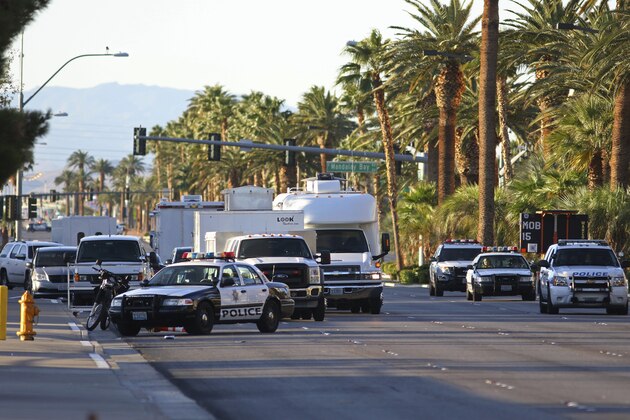 Police block a street outside of the Route 91 Harvest music festival Monday, Oct. 2, 2017, in Las Vegas. A mass shooting occurred late night Sunday at a music festival on the Las Vegas Strip. (AP Photo/Ronda Churchill)