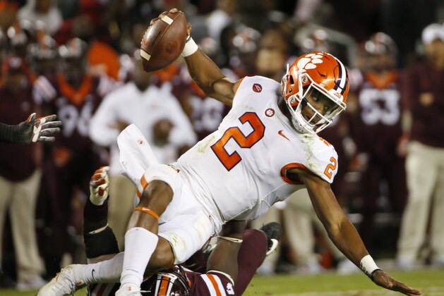 Clemson quarterback Kelly Bryant (2) is sacked by Virginia Tech defensive end Trevon Hill (94) during the second half of an NCAA college football game in Blacksburg, Va., Saturday, Sept. 30, 2017. Clemson won the game 31-17. (AP Photo/Steve Helber)