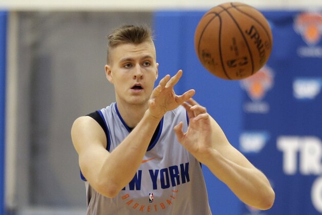 New York Knicks' Kristaps Porzingis passes during NBA basketball practice in Greenburgh, N.Y., Tuesday, Sept. 26, 2017. (AP Photo/Seth Wenig)