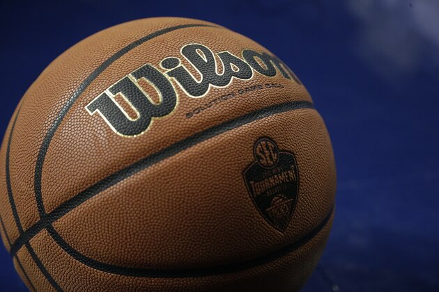 A basketball is seen on the court wight he SEC logo during the second half of the NCAA college basketball Southeastern Conference tournament championship game between Kentucky and Arkansas, Sunday, March 15, 2015, in Nashville, Tenn. (AP Photo/Mark Humphrey)
