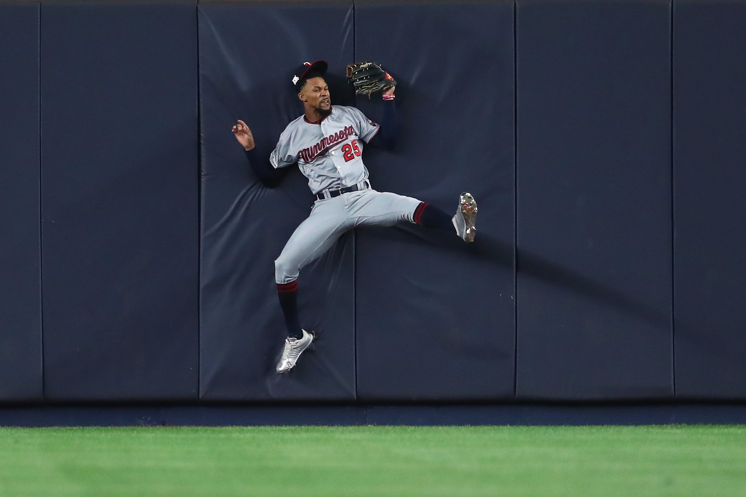 NEW YORK, NY - OCTOBER 03:  Byron Buxton #25 of the Minnesota Twins hits the wall as he catches a pop up fly against the New York Yankees during the second inning  in the American League Wild Card Game at Yankee Stadium on October 3, 2017 in the Bronx borough of New York City.  (Photo by Al Bello/Getty Images)
