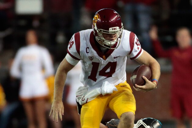PULLMAN, WA - SEPTEMBER 29:  Sam Darnold #14 of the USC Trojans is tackled by Jahad Woods #13 of the Washington State Cougars in the second half at Martin Stadium on September 29, 2017 in Pullman, Washington.  Washington State defeated USC 30-27.  (Photo by William Mancebo/Getty Images)