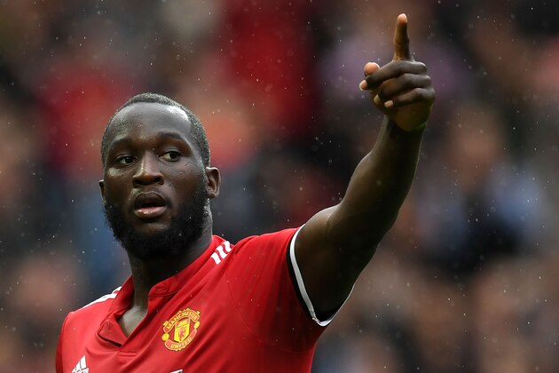 Manchester United's Belgian striker Romelu Lukaku celebrates scoring the team's fourth goal during the English Premier League football match between Manchester United and Crystal Palace at Old Trafford in Manchester, north west England, on September 30, 2017. / AFP PHOTO / Paul ELLIS / RESTRICTED TO EDITORIAL USE. No use with unauthorized audio, video, data, fixture lists, club/league logos or 'live' services. Online in-match use limited to 75 images, no video emulation. No use in betting, games or single club/league/player publications.  /         (Photo credit should read PAUL ELLIS/AFP/Getty Images)