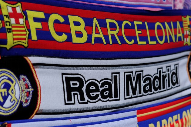 MADRID, SPAIN - MARCH 23:  Real Madrid CF and FC Barcelona scarves are seen at a merchandise stall prior to the La Liga match between Real Madrid CF and FC Barcelona at estadio Santiago Bernabeu on March 23, 2014 in Madrid, Spain.  (Photo by Denis Doyle/Getty Images)