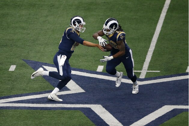 Los Angeles Rams quarterback Jared Goff (16) hands the ball off to running back Todd Gurley (30) during an NFL football game against the Dallas Cowboys on Sunday, Oct. 1, 2017, in Arlington, Texas. (AP Photo/Roger Steinman)