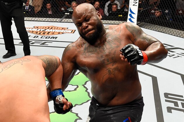 AUCKLAND, NEW ZEALAND - JUNE 11:  (R-L) Derrick Lewis punches Mark Hunt of New Zealand in their heavyweight fight during the UFC Fight Night event at the Spark Arena on June 11, 2017 in Auckland, New Zealand. (Photo by Josh Hedges/Zuffa LLC/Zuffa LLC via Getty Images)