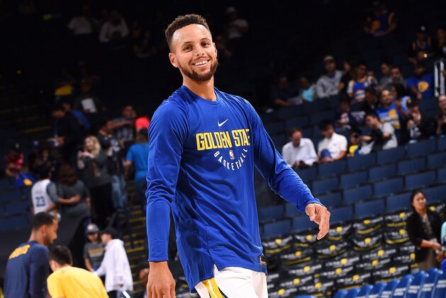OAKLAND, CA - SEPTEMBER 30: Stephen Curry #30 of the Golden State Warriors looks on before the game against the Denver Nuggets during a preseason game on September 30, 2017 at ORACLE Arena in Oakland, California. NOTE TO USER: User expressly acknowledges and agrees that, by downloading and or using this photograph, user is consenting to the terms and conditions of Getty Images License Agreement. Mandatory Copyright Notice: Copyright 2017 NBAE (Photo by Noah Graham/NBAE via Getty Images)