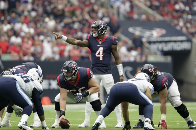 HOUSTON, TX - OCTOBER 01:  Deshaun Watson #4 of the Houston Texans calls signals from the line of scrimmage in the fourth quarter against the Tennessee Titans at NRG Stadium on October 1, 2017 in Houston, Texas.  (Photo by Tim Warner/Getty Images)