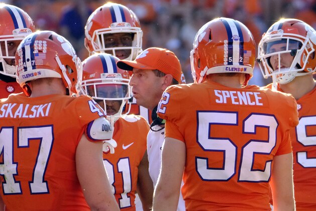 CLEMSON, SC - SEPTEMBER 23: Head coach Dabo Swinney of the Clemson Tigers talks with his players during a pause in their game against the Boston College Eagles at Memorial Stadium on September 23, 2017 in Clemson, South Carolina. (Photo by Todd Bennett/Getty Images)