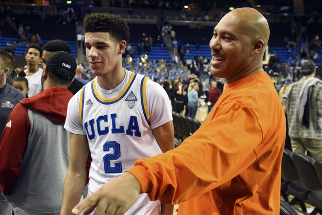 FILE - In this Nov. 20, 2016, file photo, UCLA's Lonzo Ball (2) walks by his father LaVar Ball, right, to greet family members after UCLA defeated Long Beach State in an NCAA college basketball game in Los Angeles. Former UCLA star Lonzo Ball pokes fun at his dad's outspoken nature in a commercial released in advance of Father's Day and next week's NBA Draft. (AP Photo/Michael Owen Baker, File) FILE - In this Nov. 20, 2016, file photo, UCLA's Lonzo Ball (2) walks by his father LaVar Ball, right, to greet family members after UCLA defeated Long Beach State in an NCAA college basketball game in Los Angeles. Former UCLA star Lonzo Ball pokes fun at his dad's outspoken nature in a commercial released in advance of Father's Day and next week's NBA Draft. (AP Photo/Michael Owen Baker, File)