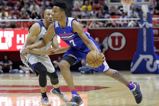 FILE - In this Wednesday, July 5, 2017, file photo, Philadelphia 76ers guard Markelle Fultz (7) drives around Utah Jazz guard Dante Exum during the first half of an NBA summer league basketball game in Salt Lake City. Fultz needed to be helped off the court with an injury to his left ankle in the 76ers' summer league game Saturday, July 8, against Golden State. (AP Photo/Rick Bowmer, File)