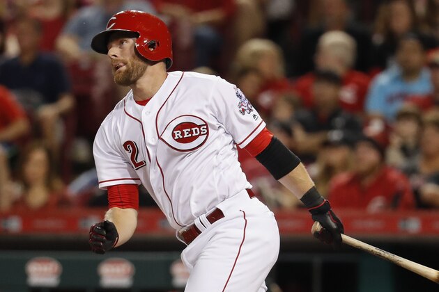 Cincinnati Reds' Zack Cozart hits a solo home run off Pittsburgh Pirates starting pitcher Chad Kuhl in the third inning of a baseball game, Friday, Sept. 15, 2017, in Cincinnati. The Reds won 4-2. (AP Photo/John Minchillo)