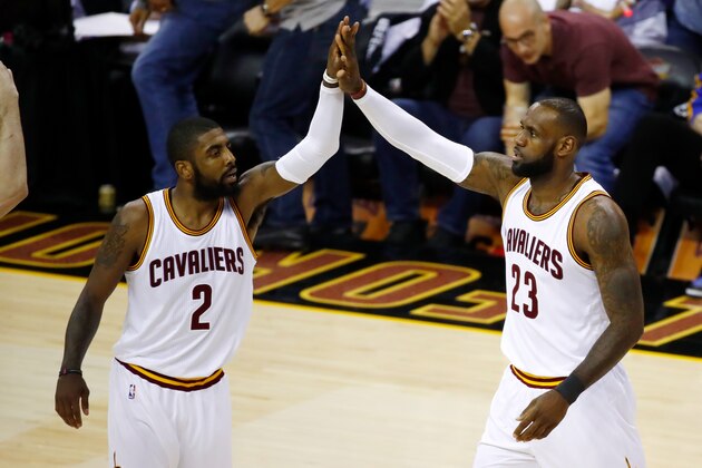 CLEVELAND, OH - JUNE 09: Kyrie Irving #2 and LeBron James #23 of the Cleveland Cavaliers high five against the Golden State Warriors in Game 4 of the 2017 NBA Finals at Quicken Loans Arena on June 9, 2017 in Cleveland, Ohio. NOTE TO USER: User expressly acknowledges and agrees that, by downloading and or using this photograph, User is consenting to the terms and conditions of the Getty Images License Agreement.  (Photo by Gregory Shamus/Getty Images)