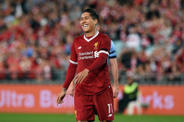 Liverpool's Roberto Firmino celebrates his goal against Sydney FC during their end-of-season friendly football match at the Olympic Stadium in Sydney on May 24, 2017. / AFP PHOTO / SAEED KHAN / IMAGE RESTRICTED TO EDITORIAL USE - STRICTLY NO COMMERCIAL USE        (Photo credit should read SAEED KHAN/AFP/Getty Images)