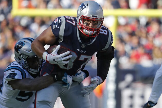 New England Patriots tight end Rob Gronkowski tries to break a tackle against the Carolina Panthers during an NFL football game at Gillette Stadium in Foxborough, Mass. Sunday, Oct. 1, 2017. (Winslow Townson/AP Images for Panini)