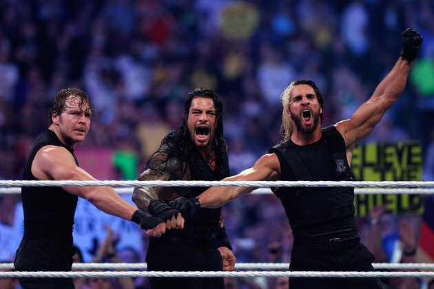 The Shield reacts after their win during Wrestlemania XXX at the Mercedes-Benz Super Dome in New Orleans on Sunday, April 6, 2014. (Jonathan Bachman/AP Images for WWE)
