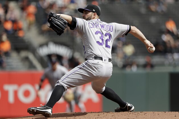 Colorado Rockies starting pitcher Tyler Chatwood throws to the San Francisco Giants during the first inning of a baseball game Wednesday, Sept. 20, 2017, in San Francisco. (AP Photo/Marcio Jose Sanchez)