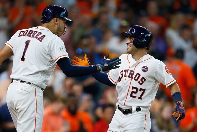 HOUSTON, TX - OCTOBER 05:  Jose Altuve #27 of the Houston Astros celebrates with Carlos Correa #1 after hitting a home run in the seventh inning against the Boston Red Sox during game one of the American League Division Series at Minute Maid Park on October 5, 2017 in Houston, Texas.  (Photo by Bob Levey/Getty Images)