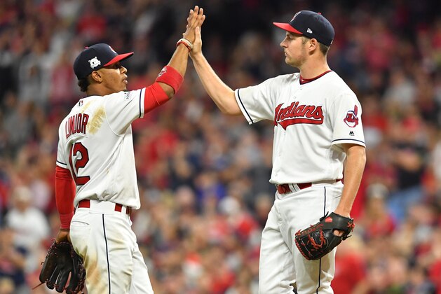 CLEVELAND, OH - OCTOBER 05:  Francisco Lindor #12 congratulates Trevor Bauer #47 of the Cleveland Indians as he is taken out of the game during the seventh inning against the New York Yankees during game one of the American League Division Series at Progressive Field on October 5, 2017 in Cleveland, Ohio.  (Photo by Jason Miller/Getty Images)