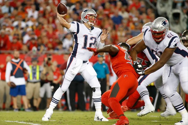 TAMPA, FL - OCTOBER 5:  Quarterback Tom Brady #12 of the New England Patriots throws to an open receiver during the first quarter of an NFL football game against the Tampa Bay Buccaneers on October 5, 2017 at Raymond James Stadium in Tampa, Florida. (Photo by Brian Blanco/Getty Images)